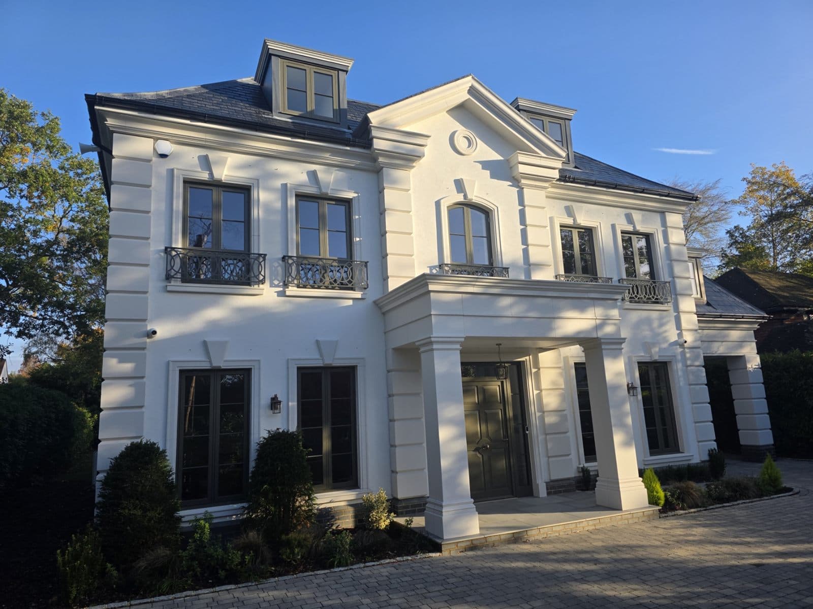Front elevation with portico, rusticated quoins and central pediment