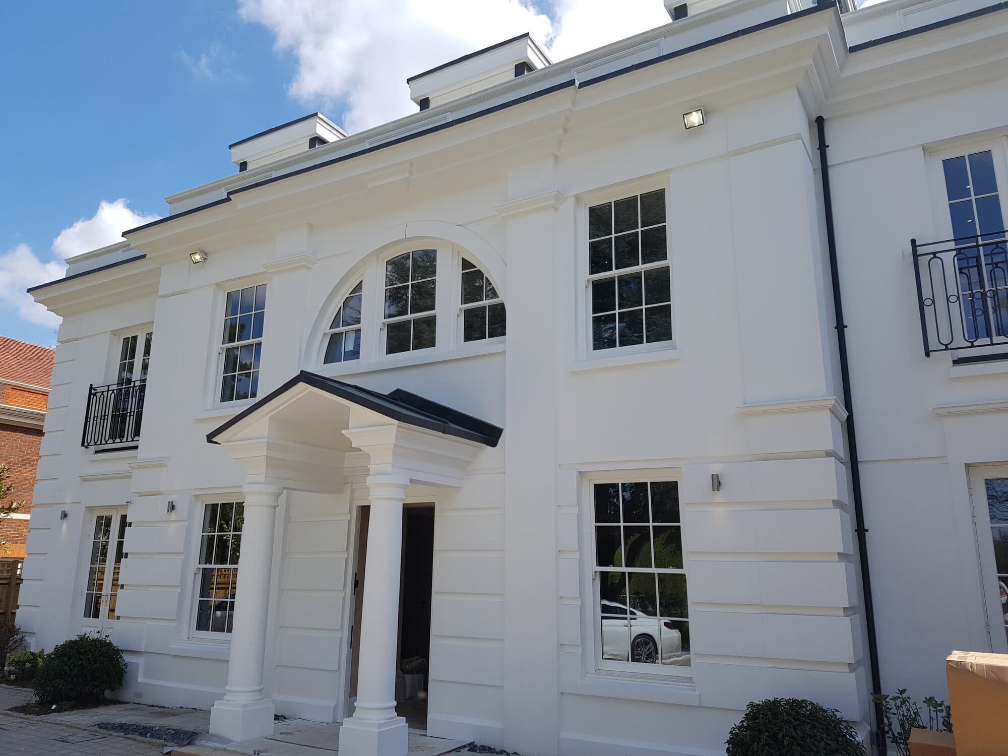 Taylormade Facades completed private development — render facade with cornice, arched window and portico detailing