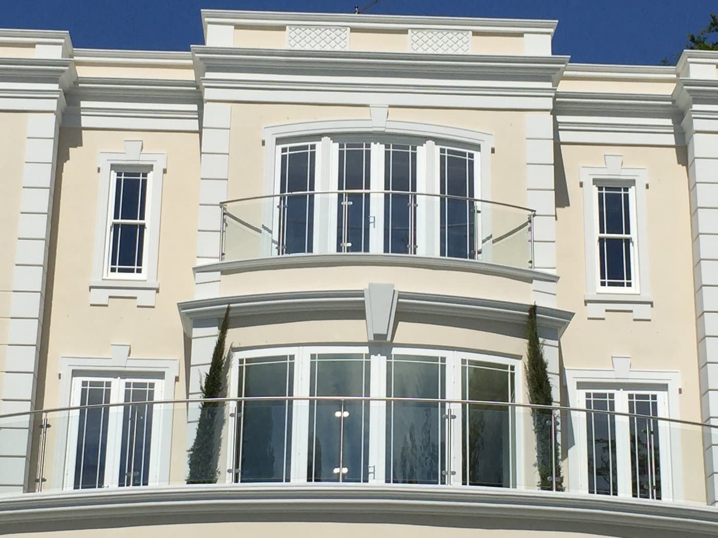 Curved bay-window profiles and window surrounds on the rear elevation of the St George’s Hill residence.