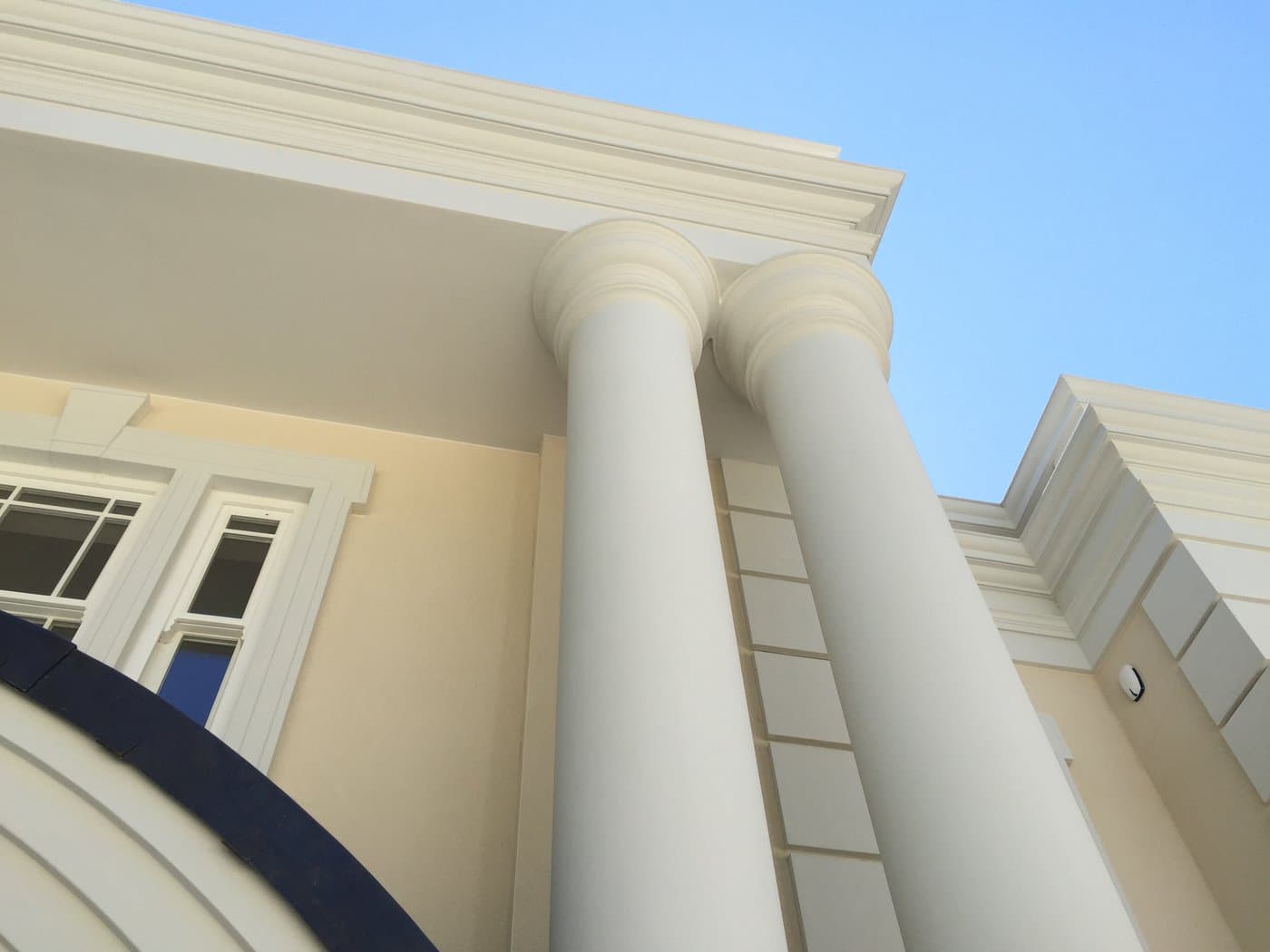 Full-height portico columns, capitals and cornice at the St George’s Hill self-build residence.