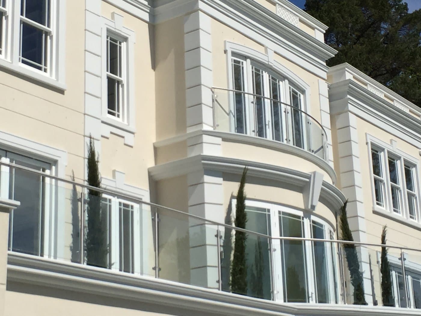 Curved bay-window profile, pilaster details and window surrounds at the St George’s Hill residence.