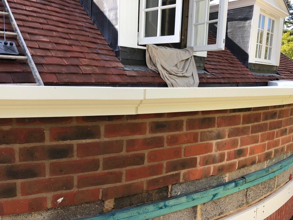 Outer face of the curved parapet and capping.