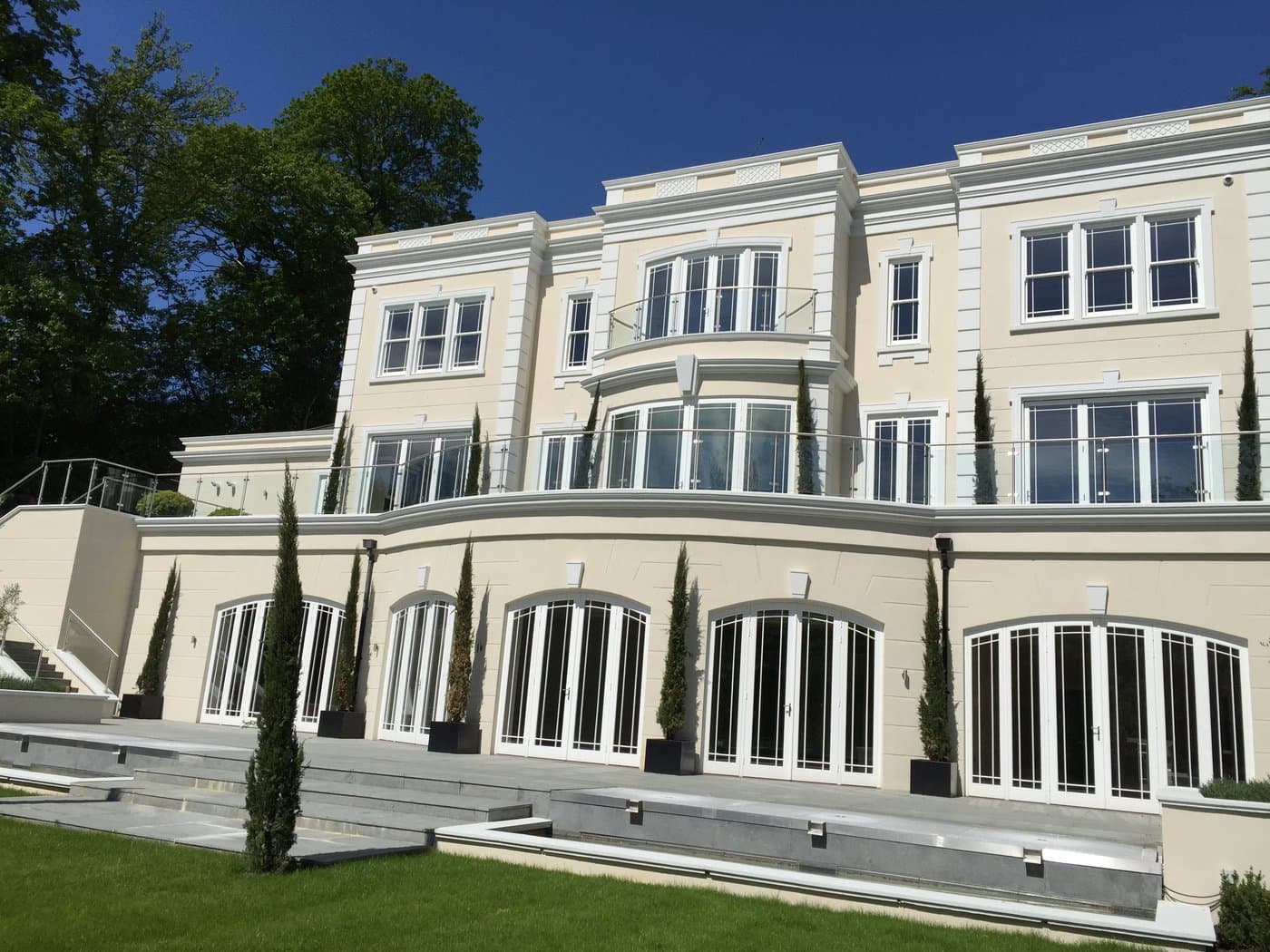 Rear elevation with window surrounds and cornice.