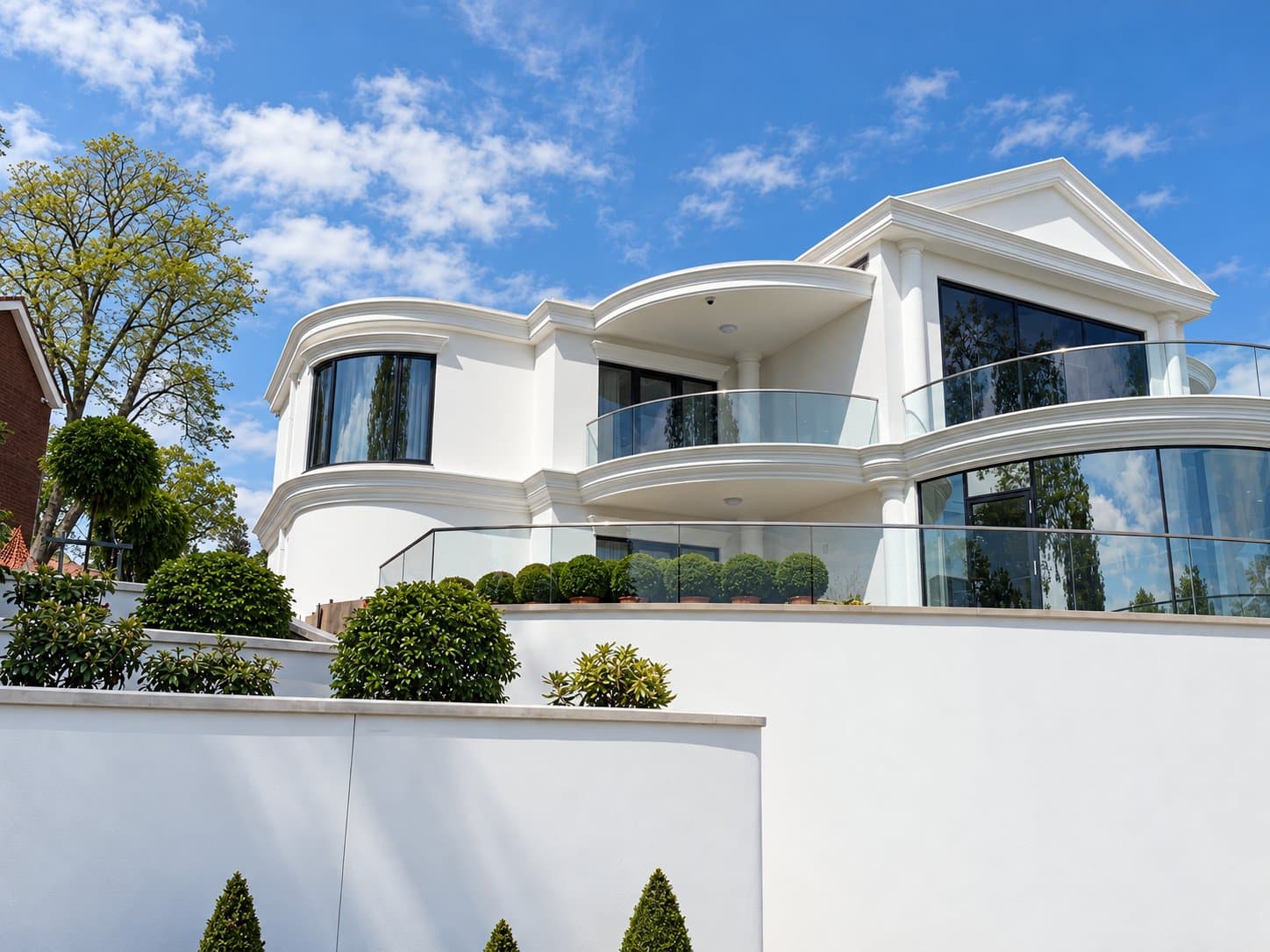 Rear elevation of the Swansea house showing the curved bay, balcony cornice and glazed gable pediment.